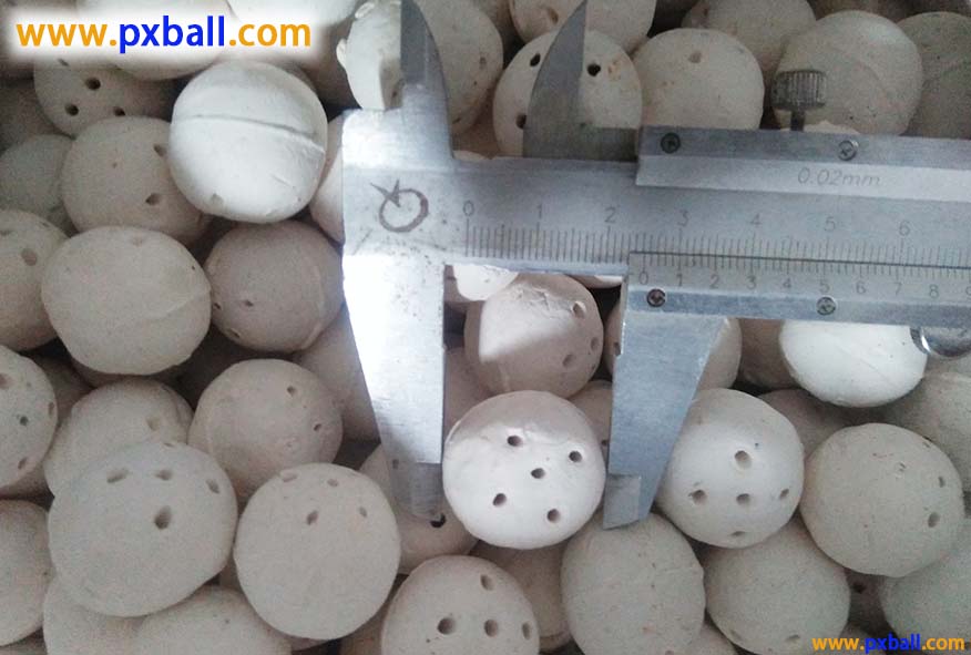 Porous inert ceramic balls